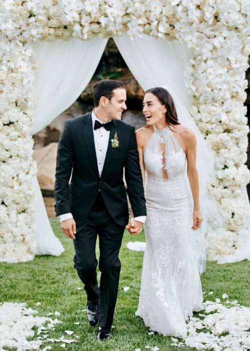 Leila and her lucky partner walking side by side while holding hands. They are gazing into each other’s eyes with pure joy and excitement for their new adventure.